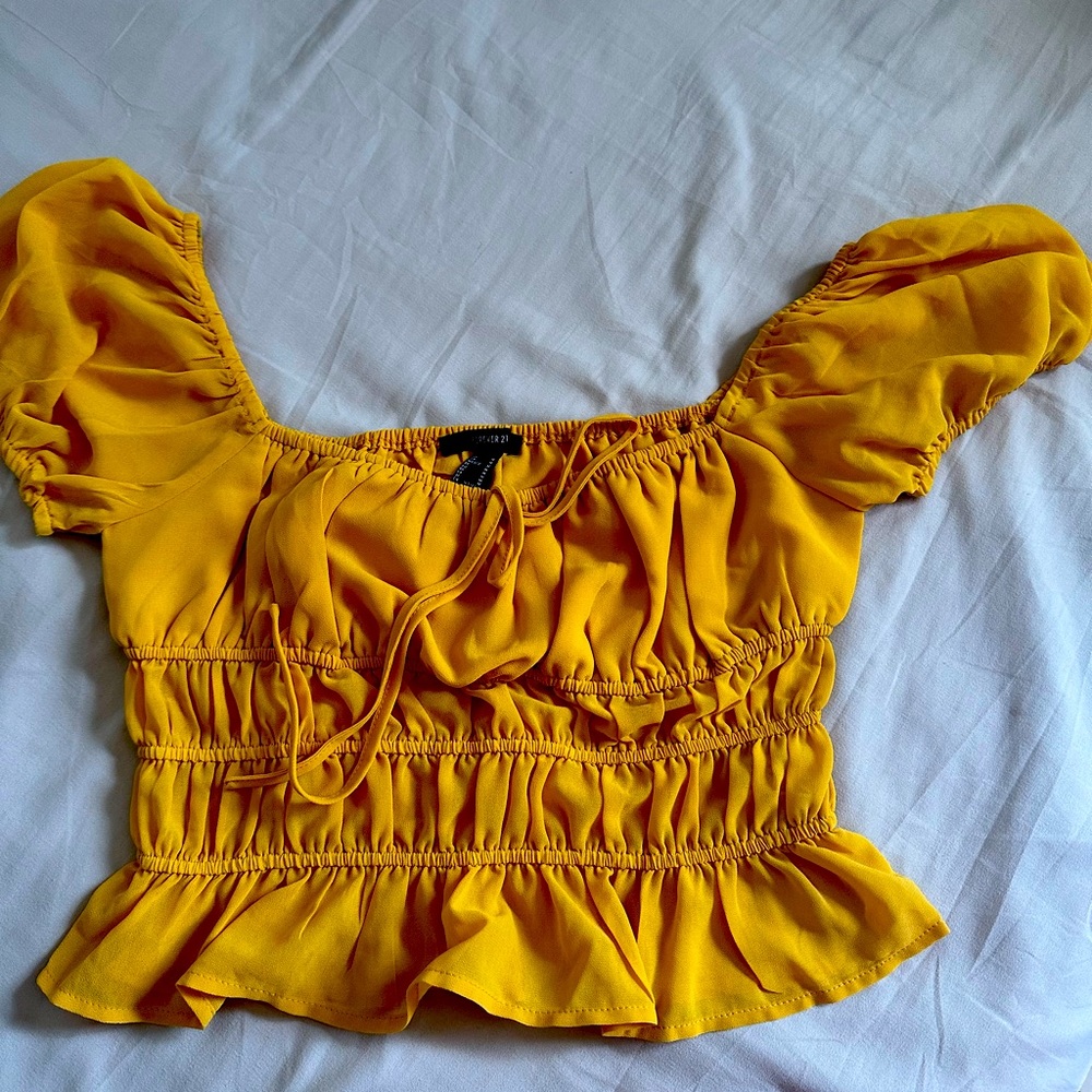 The shirt is very beautiful ,the size is M but it can fit a S